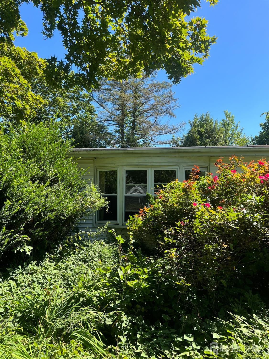 265 Friendship Road Cranbury, NJ 08512 - Photo 14 of 15 front view of a house with a garden