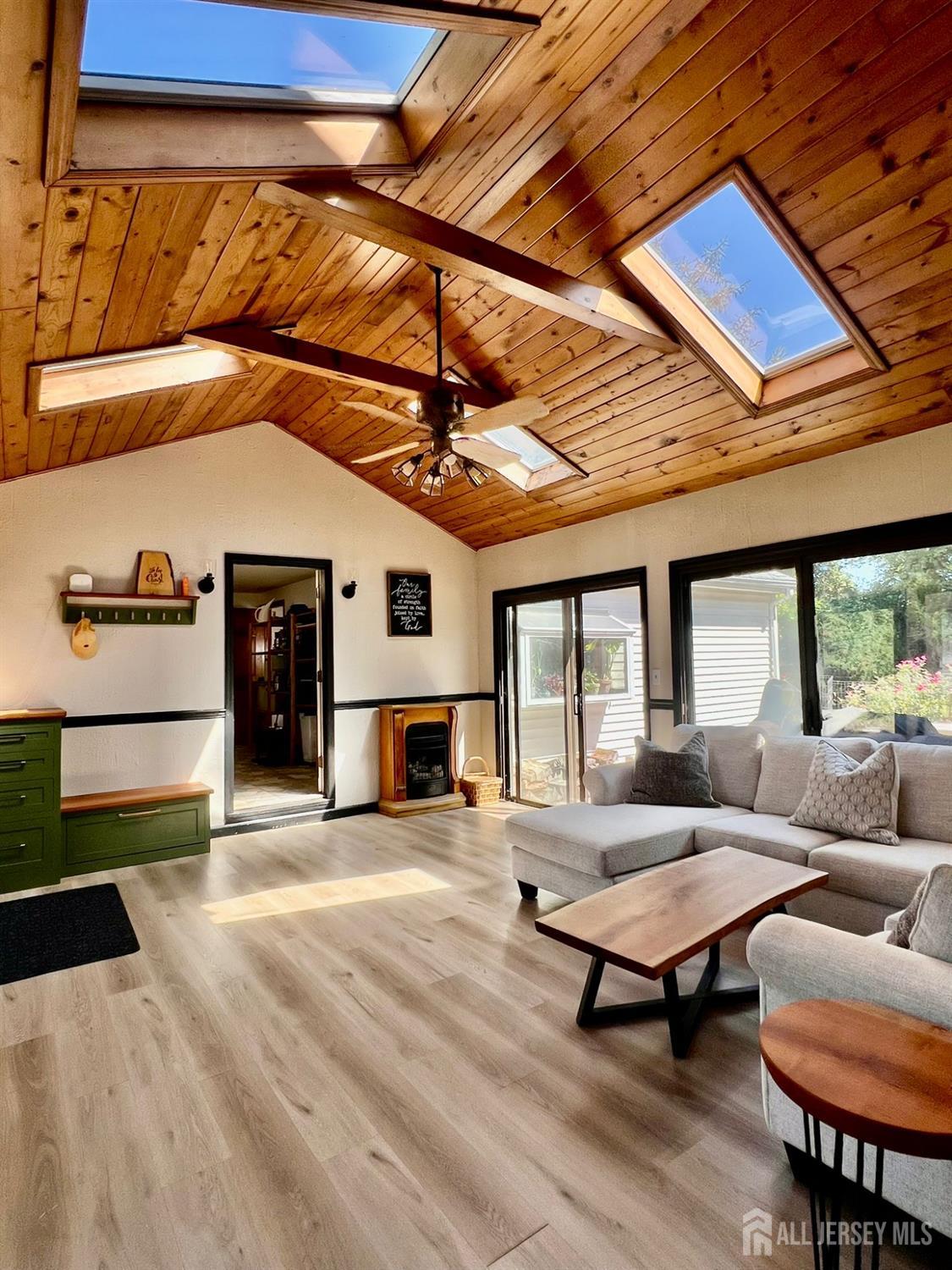 265 Friendship Road Cranbury, NJ 08512 - Photo 3 of 15 a living room with furniture a fireplace and city view