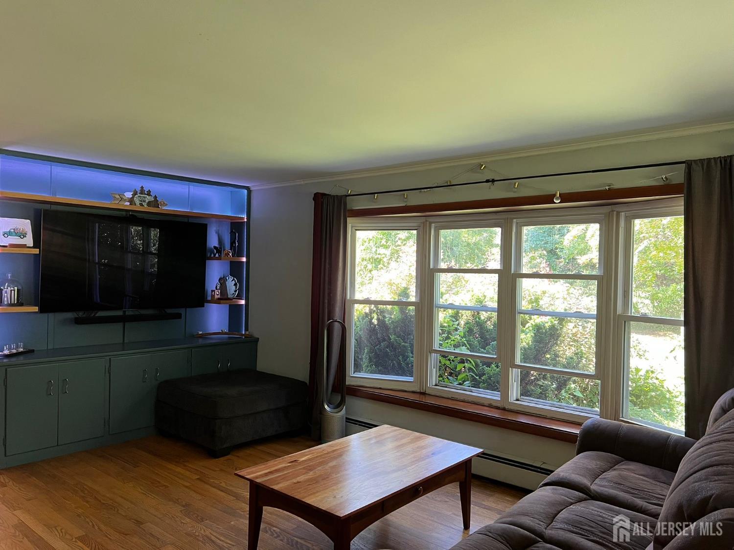 265 Friendship Road Cranbury, NJ 08512 - Photo 7 of 15 a living room with furniture and a flat screen tv