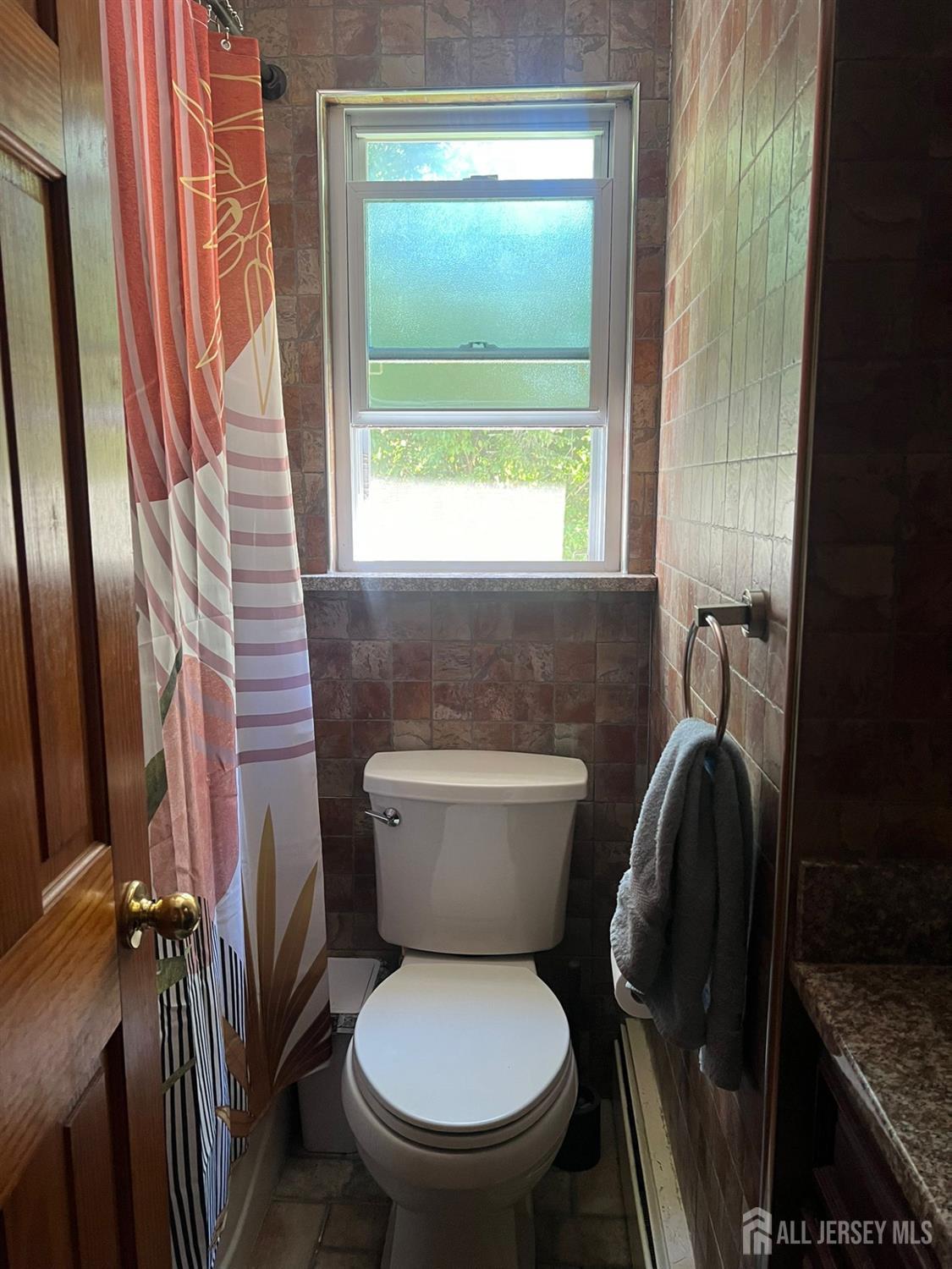 265 Friendship Road Cranbury, NJ 08512 - Photo 10 of 15 a white toilet sitting next to a window