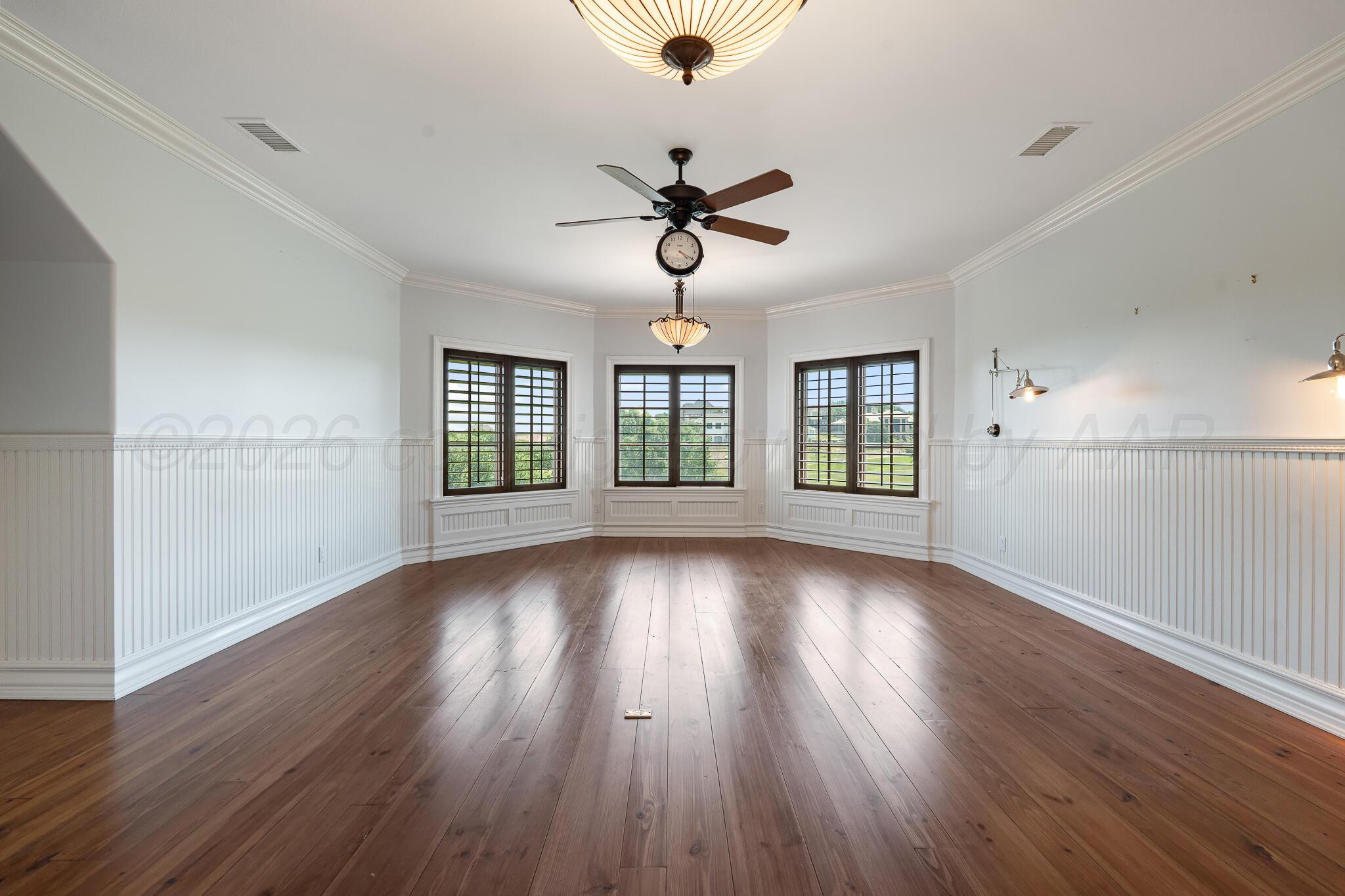 18 Cypress Point Amarillo, TX 79124 - Photo 69 of 95 a view of an empty room with wooden floor and a window