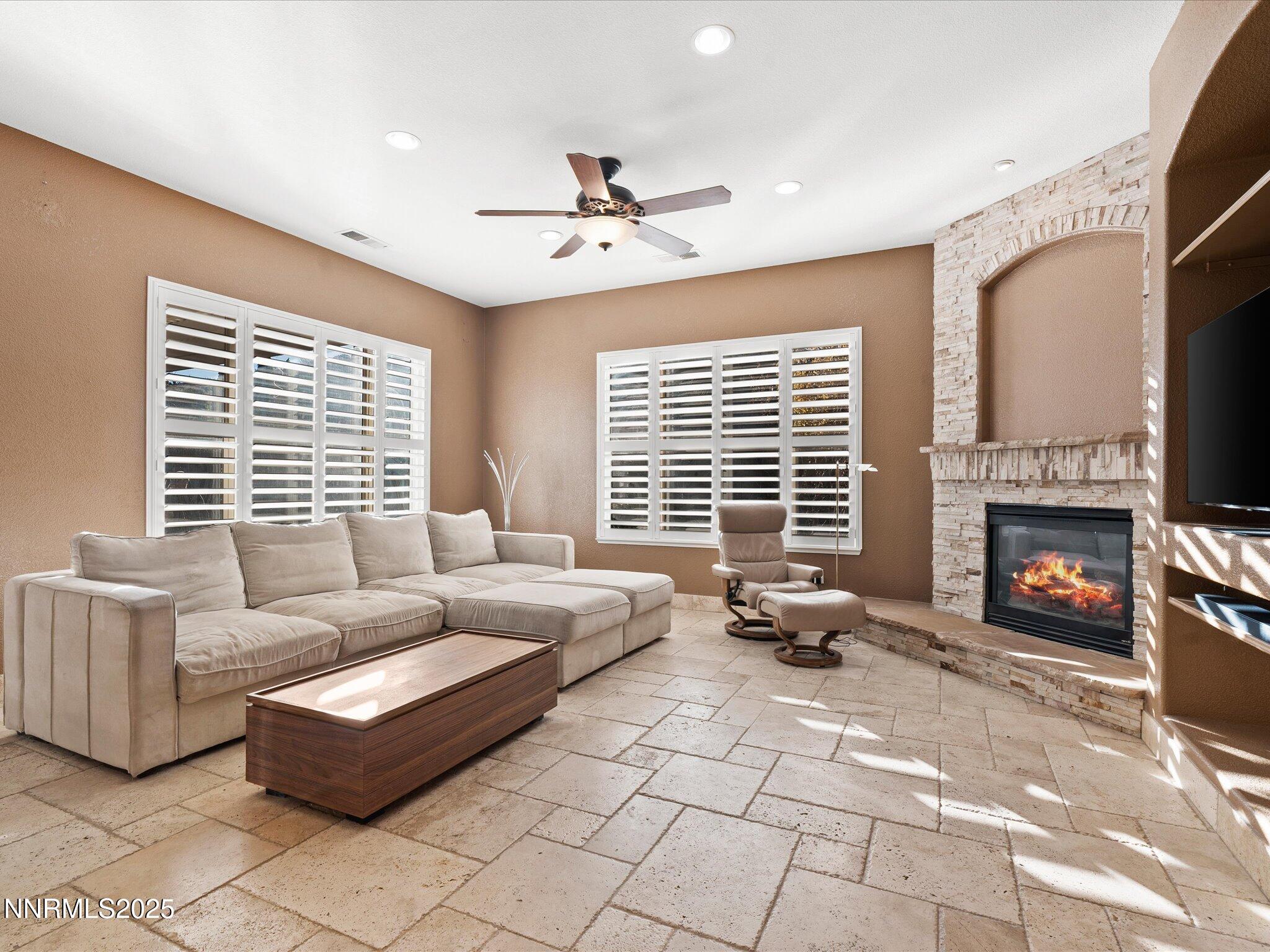 5519 New Mexico Court Reno, NV 89511 - Photo 11 of 60 a living room with furniture and a fireplace