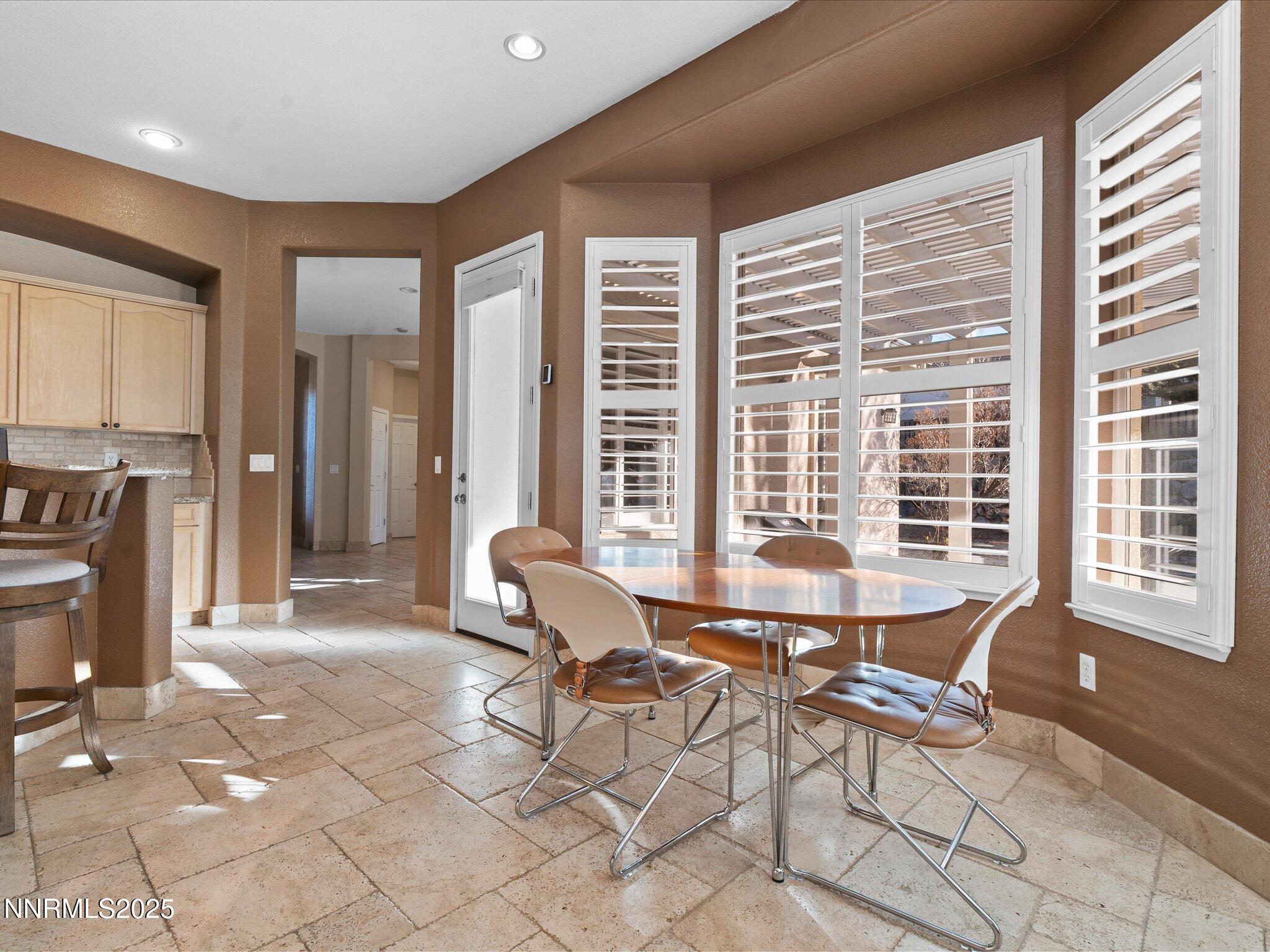 5519 New Mexico Court Reno, NV 89511 - Photo 14 of 60 a living room with furniture and large windows