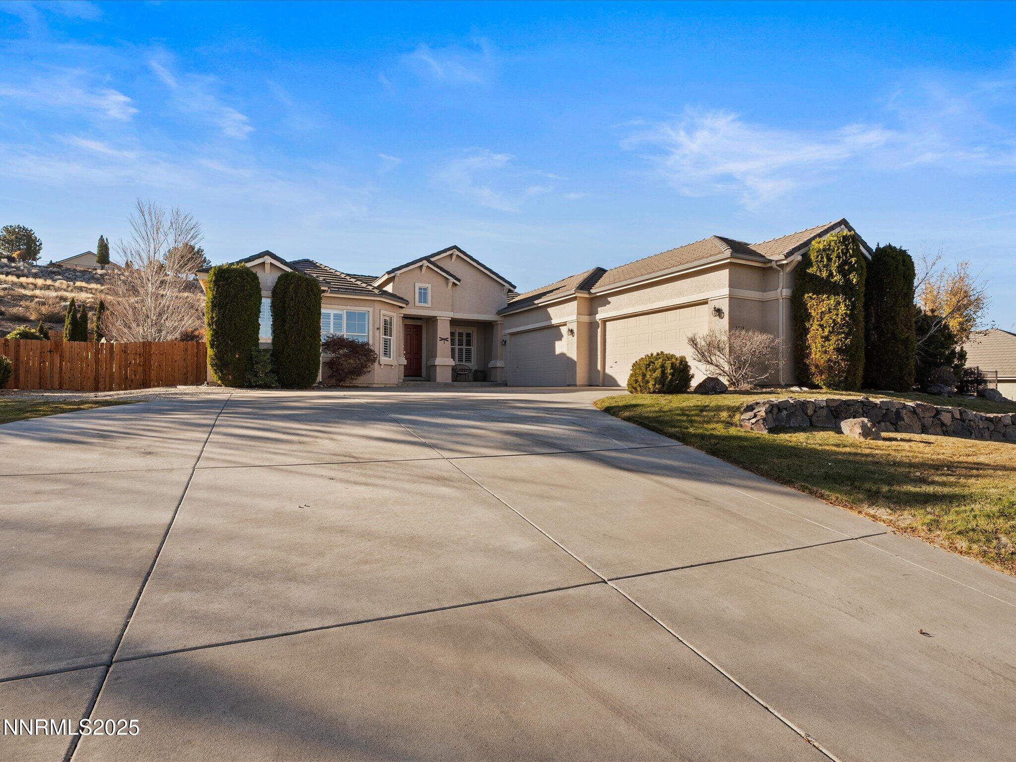 5519 New Mexico Court Reno, NV 89511 - Photo 2 of 60 a front view of a house with a yard