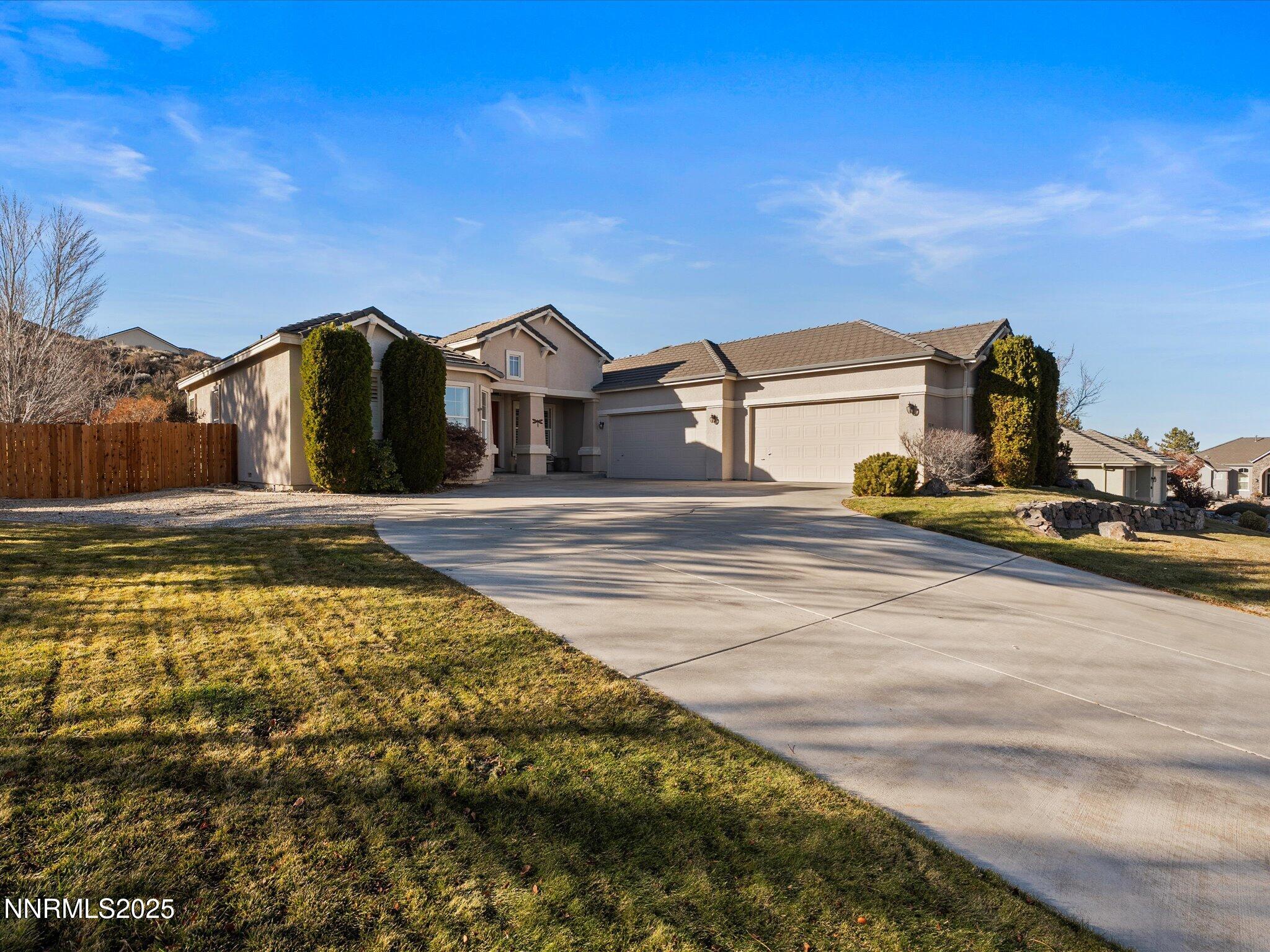 5519 New Mexico Court Reno, NV 89511 - Photo 3 of 60 a front view of a house with a yard