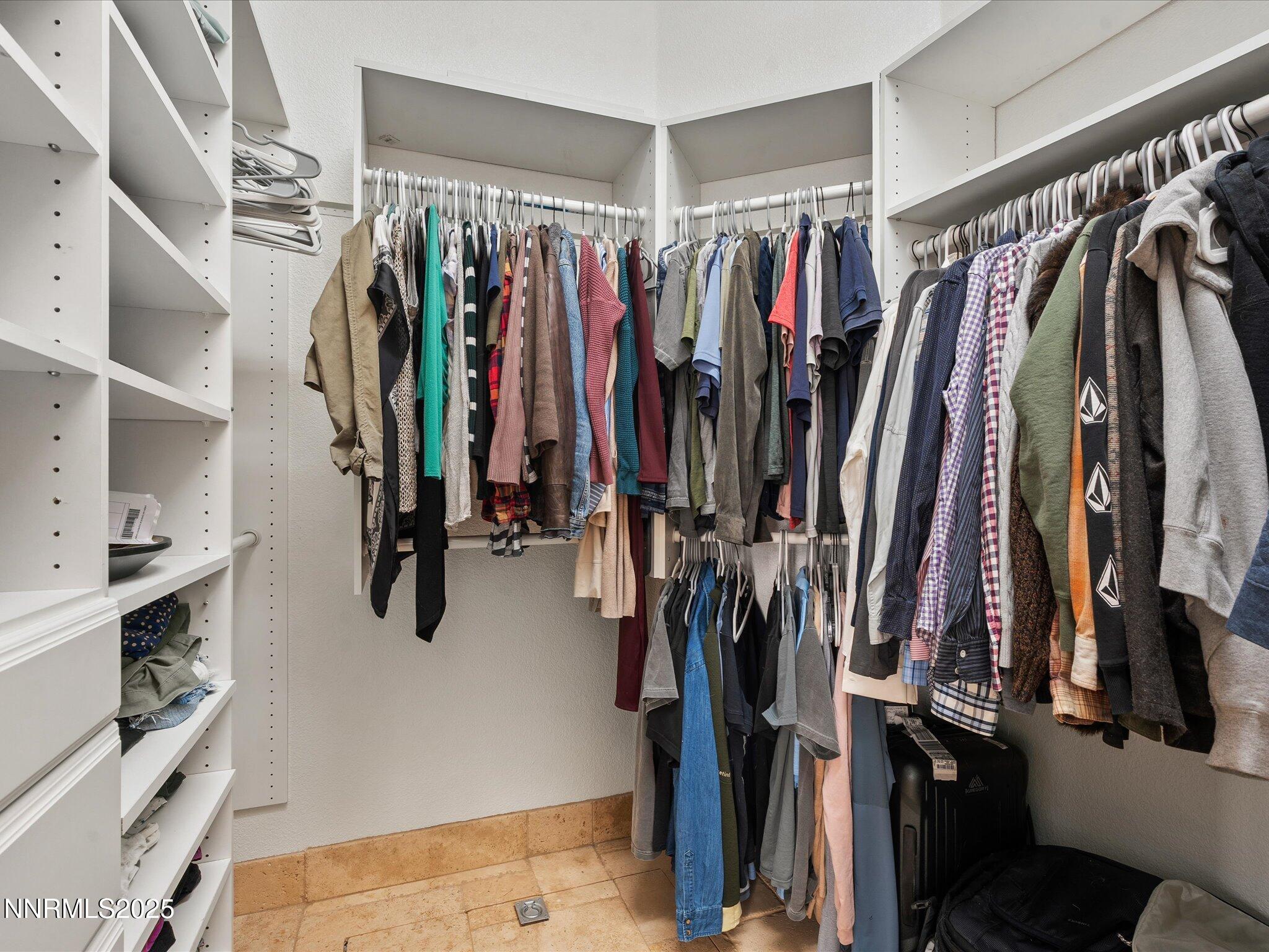 5519 New Mexico Court Reno, NV 89511 - Photo 32 of 60 a view of walk in closet with clothes