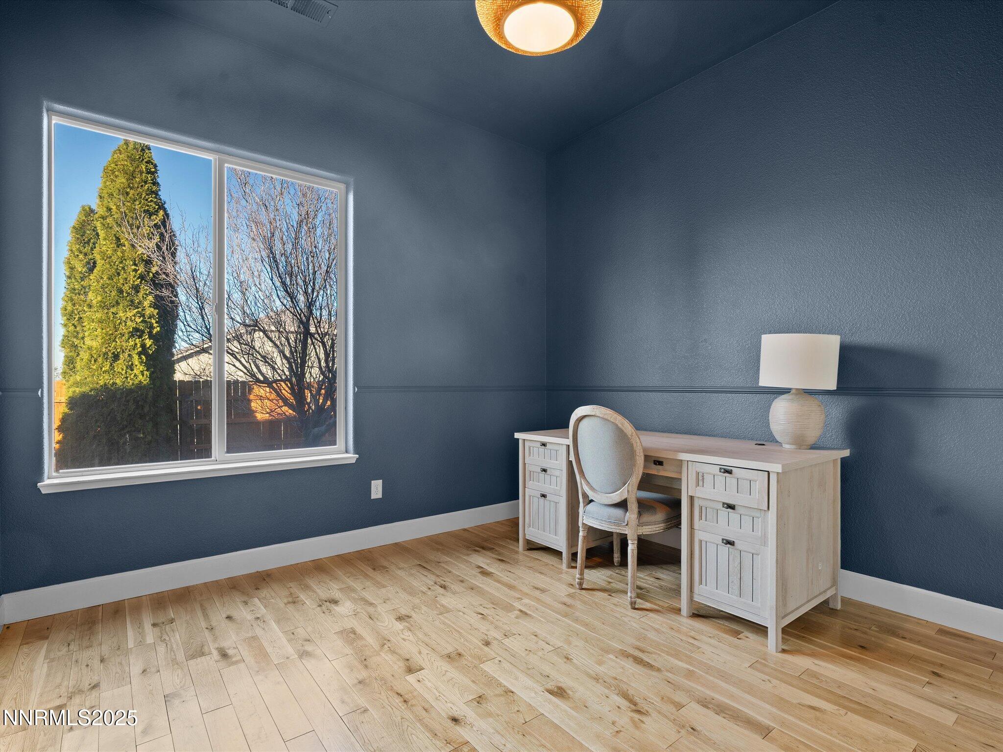 5519 New Mexico Court Reno, NV 89511 - Photo 34 of 60 a workspace room with furniture and wooden floor