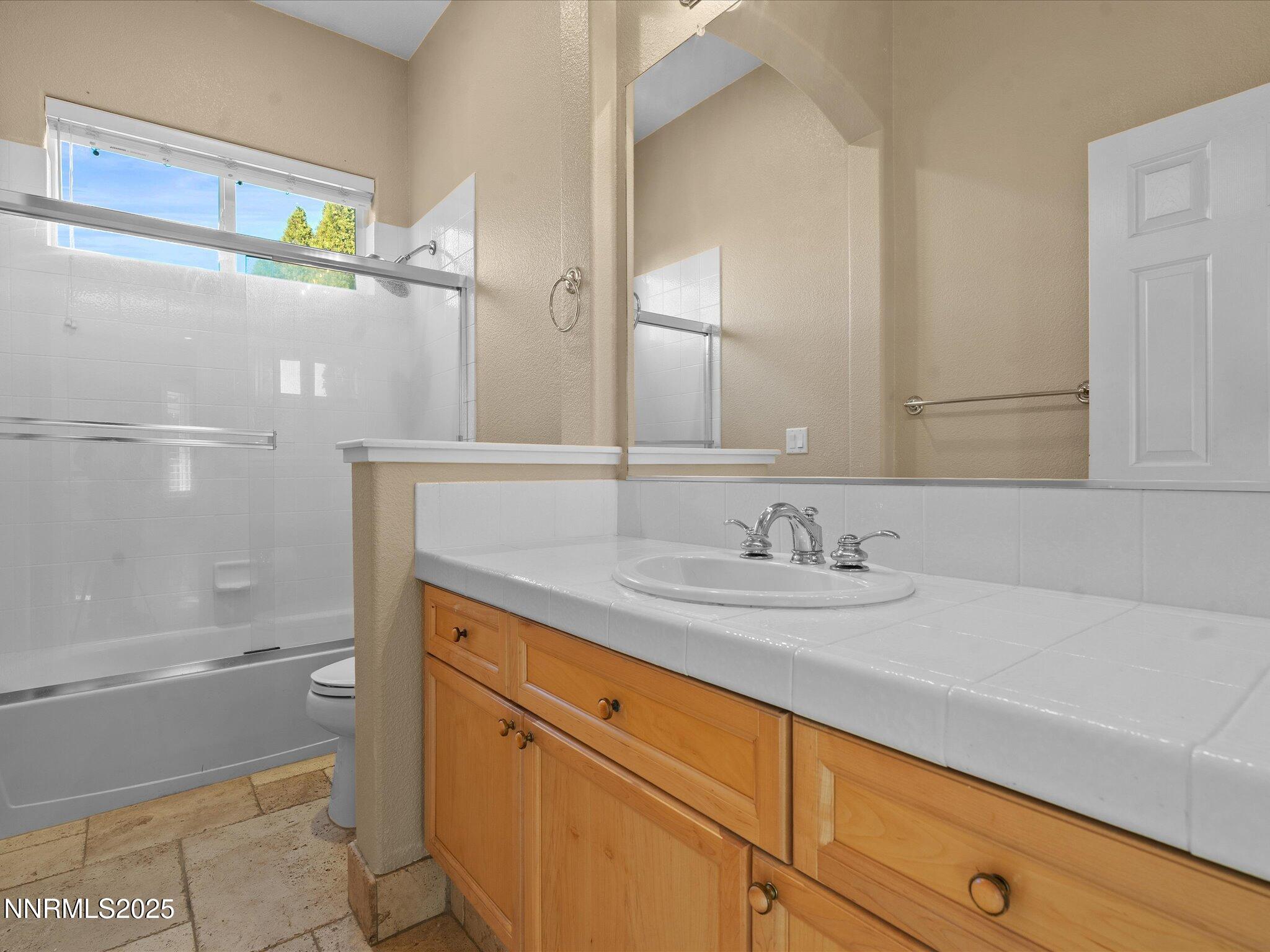5519 New Mexico Court Reno, NV 89511 - Photo 37 of 60 a bathroom with a sink and a bathtub