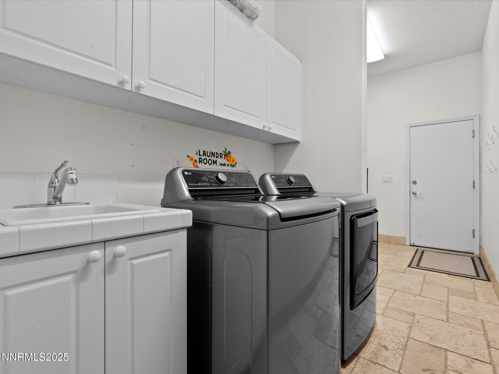 5519 New Mexico Court Reno, NV 89511 - Photo 38 of 60 a utility room with sink dryer and washer