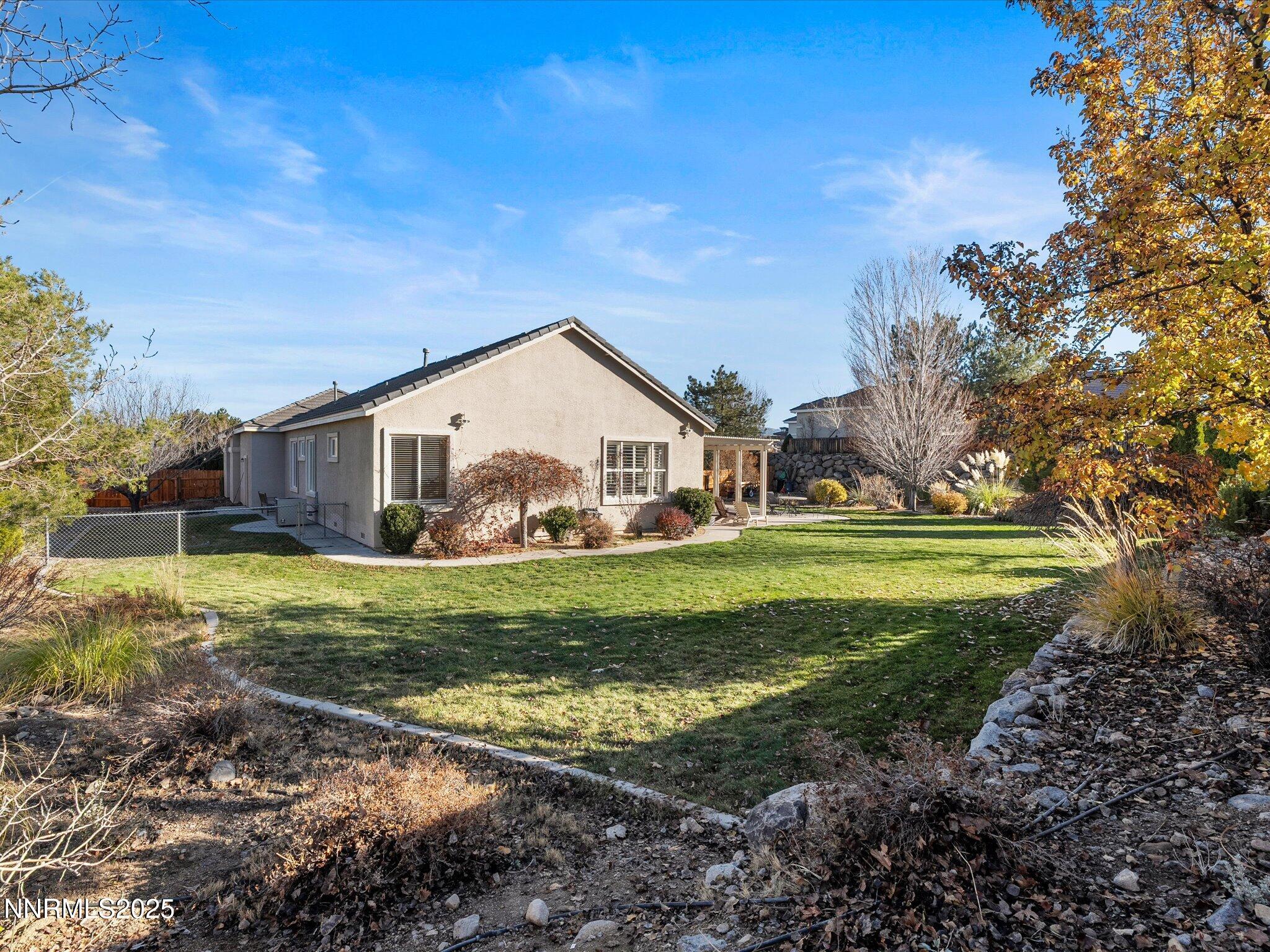 5519 New Mexico Court Reno, NV 89511 - Photo 41 of 60 a view of a house with a yard