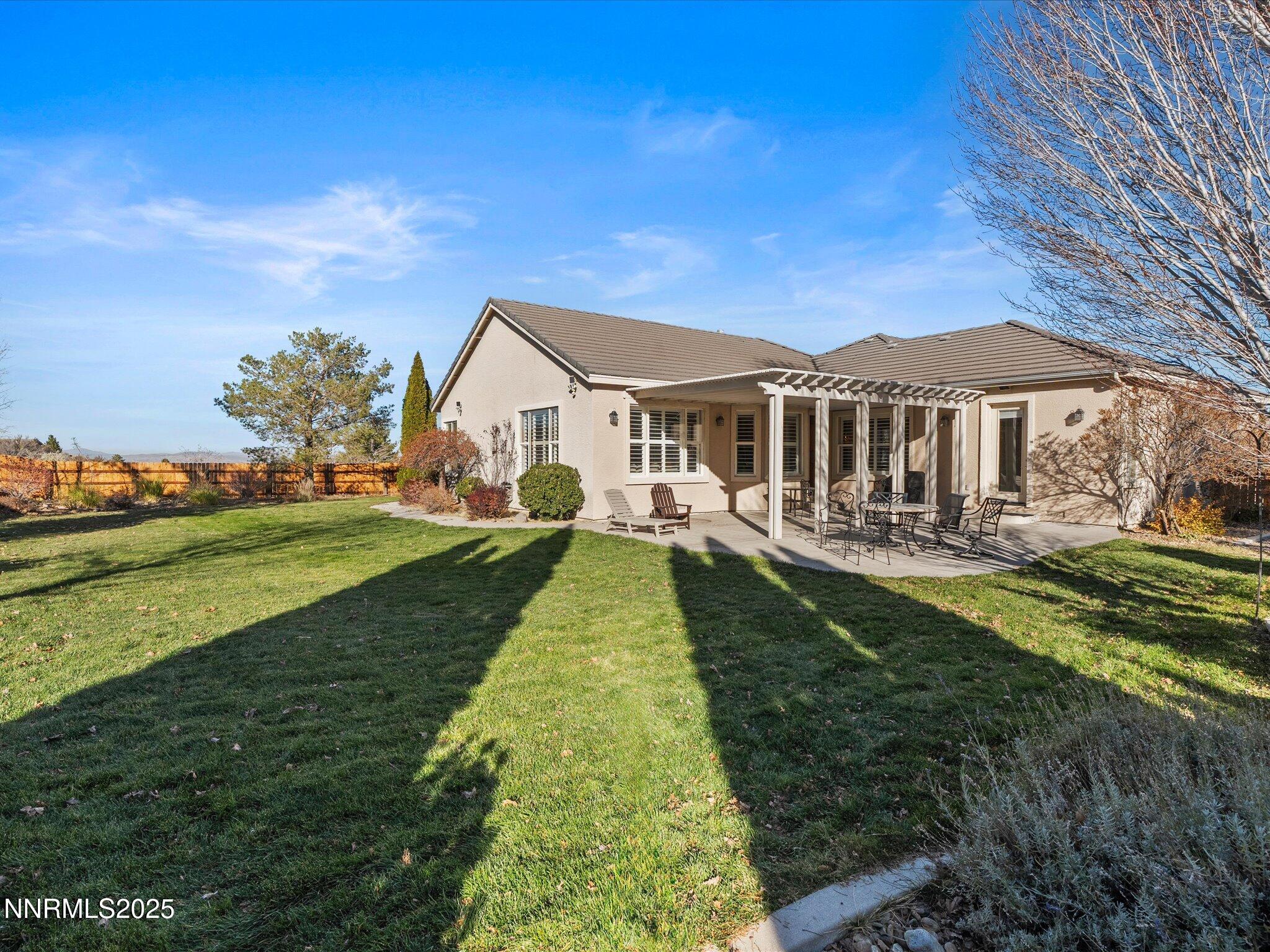 5519 New Mexico Court Reno, NV 89511 - Photo 42 of 60 a front view of a house with a yard table and chairs