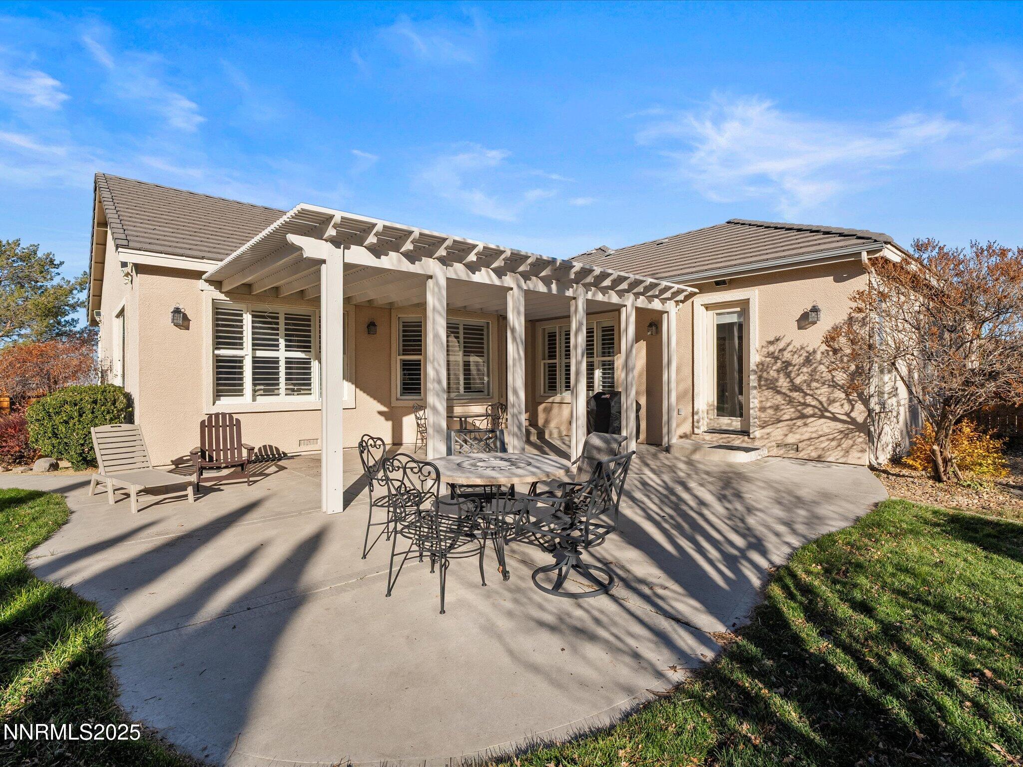 5519 New Mexico Court Reno, NV 89511 - Photo 45 of 60 a view of a house with backyard sitting area and garden