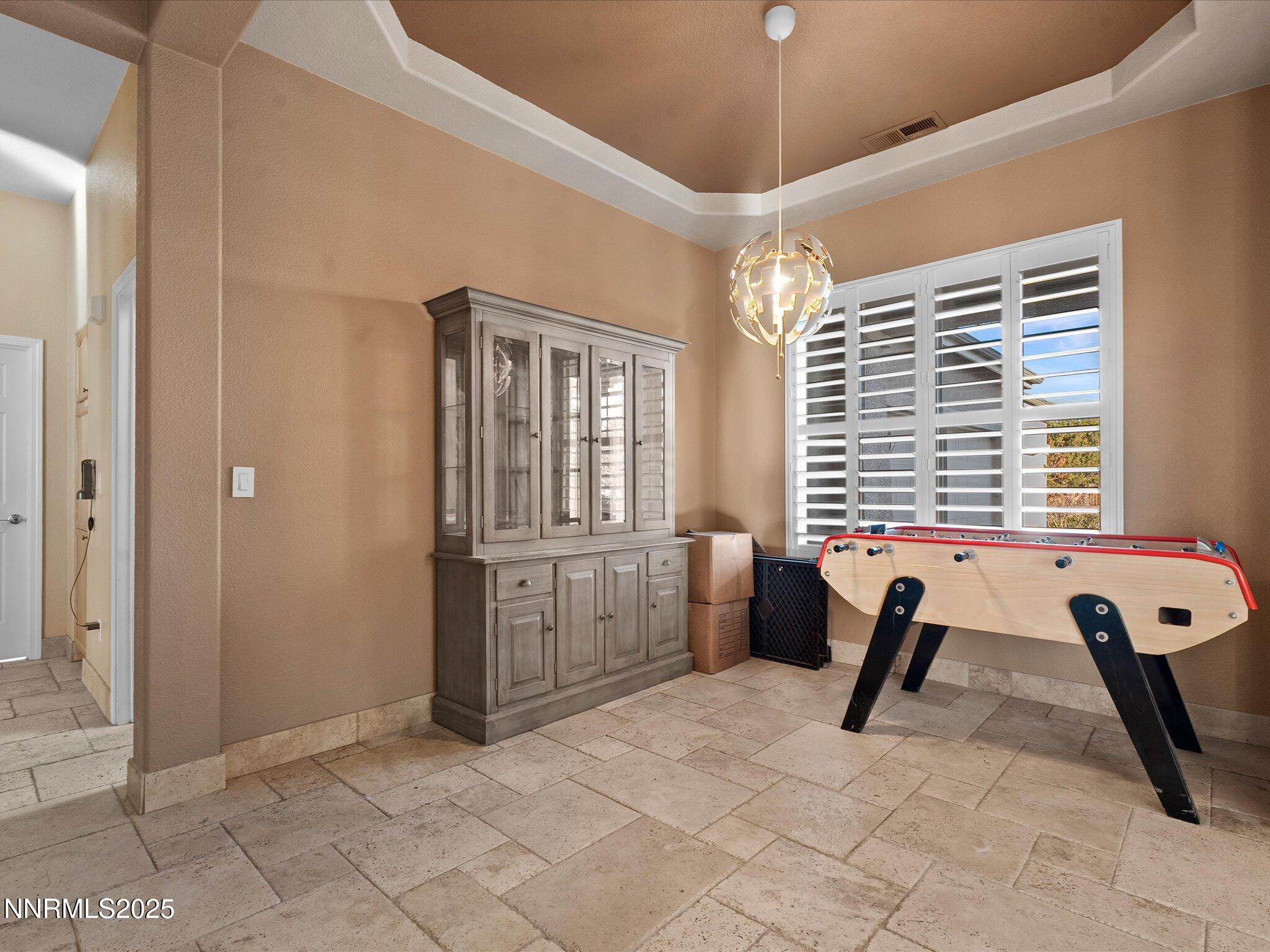 5519 New Mexico Court Reno, NV 89511 - Photo 9 of 60 a view of a workspace with furniture and a window