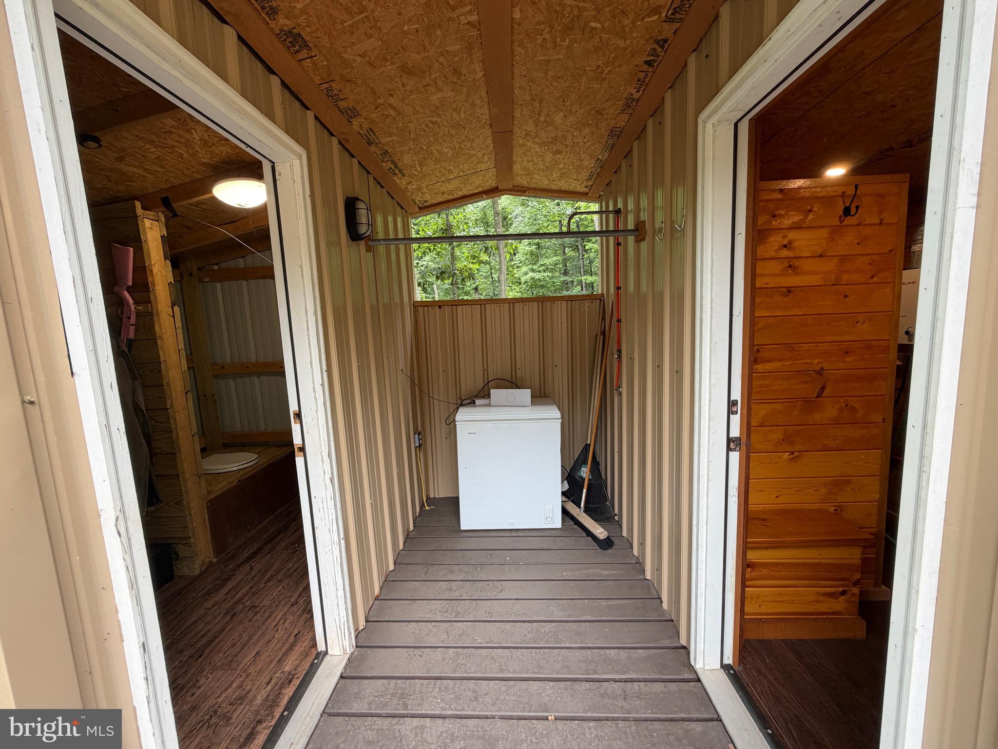 1419 Paul's Woods Road Delray, WV 26714 - Photo 39 of 105 a view of a hallway with wooden floor and staircase