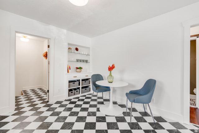 4883 South Center Street Murray, UT 84107 - Photo 9 of 32 Black and white checkerboard flooring throughout this bright room
