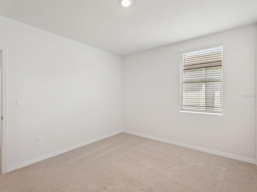7722 Satterfield Terrace Parrish, FL 34219 - Photo 12 of 22 an empty room with a window
