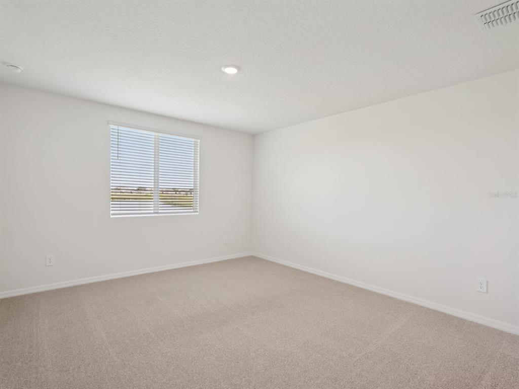 7722 Satterfield Terrace Parrish, FL 34219 - Photo 16 of 22 an empty room with a window