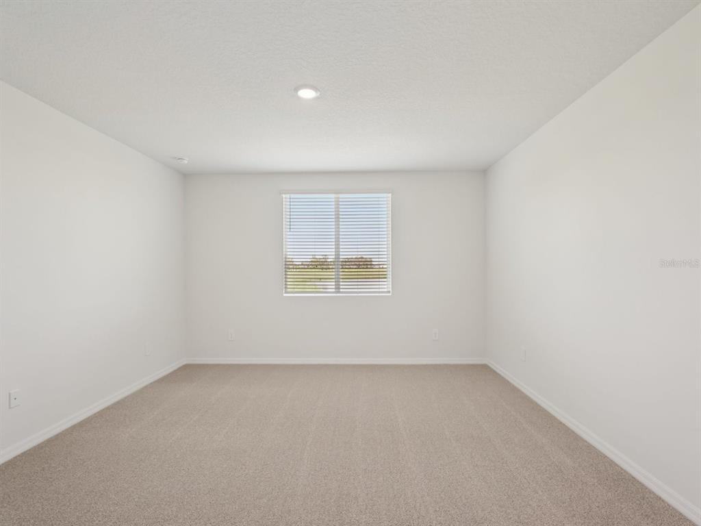 7722 Satterfield Terrace Parrish, FL 34219 - Photo 17 of 22 an empty room with a window