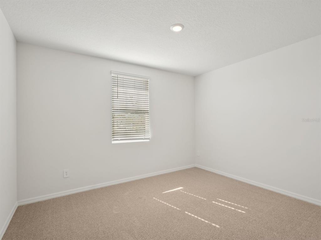 7722 Satterfield Terrace Parrish, FL 34219 - Photo 8 of 22 an empty room with a window
