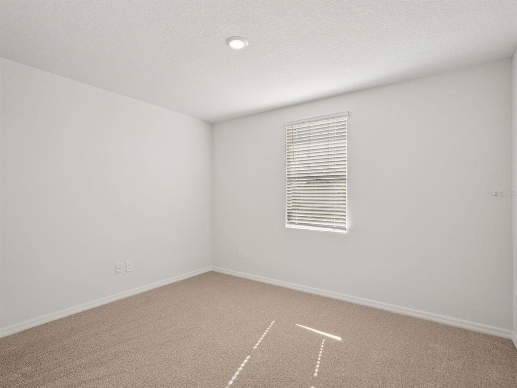 7722 Satterfield Terrace Parrish, FL 34219 - Photo 10 of 22 an empty room with a window