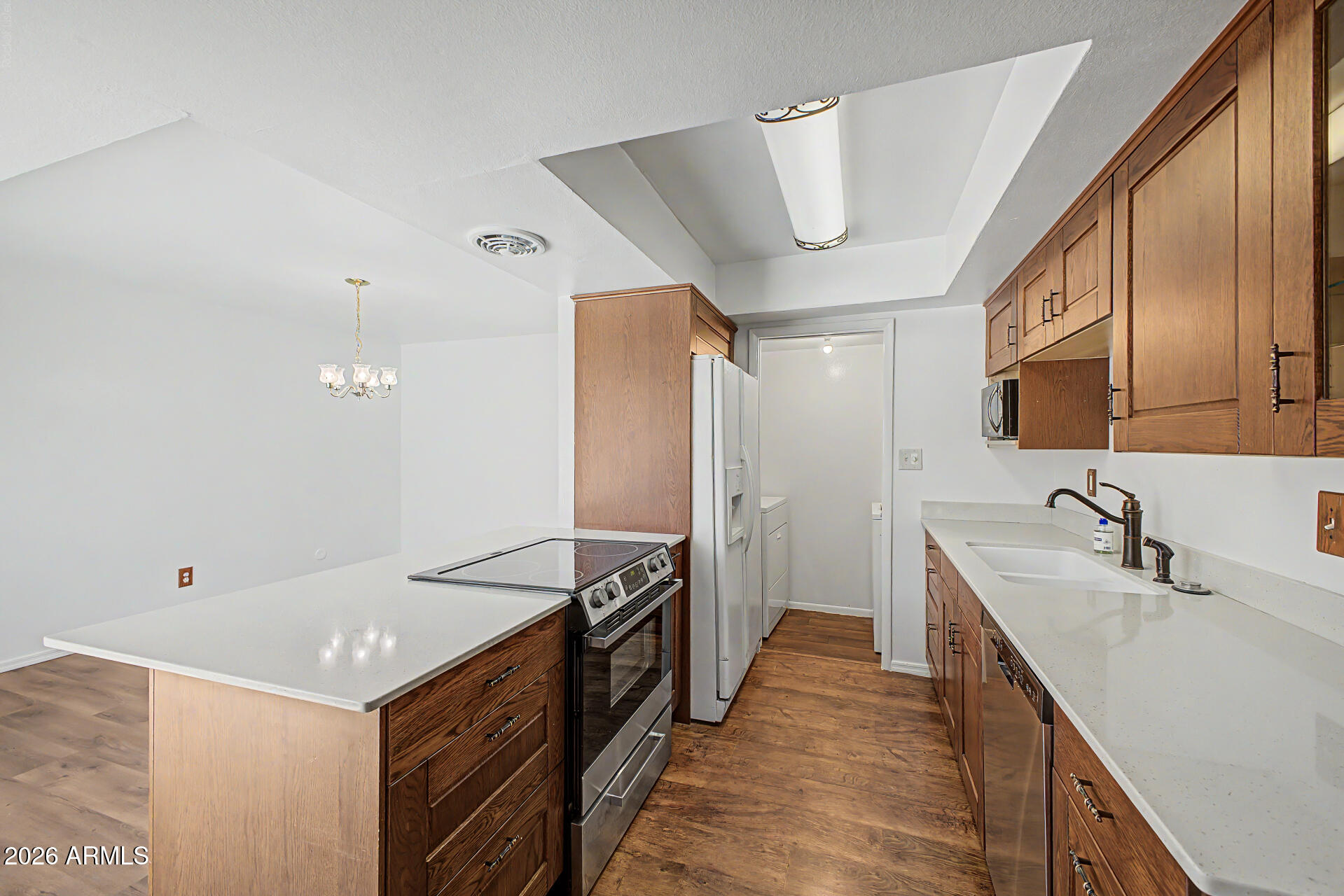 5873 East Thomas Road Scottsdale, AZ 85251 - Photo 8 of 30 a kitchen with a sink stove and refrigerator