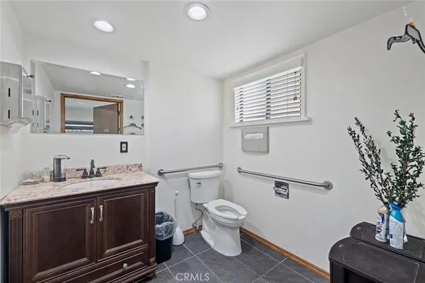 a open kitchen with stainless steel appliances granite countertop a sink dishwasher stove and refrigerator