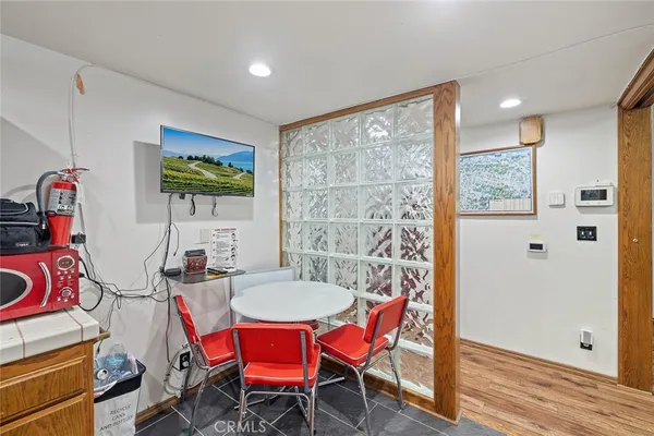 a view of a livingroom with furniture and a kitchen