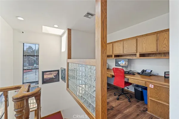 a work room with furniture and wooden floor