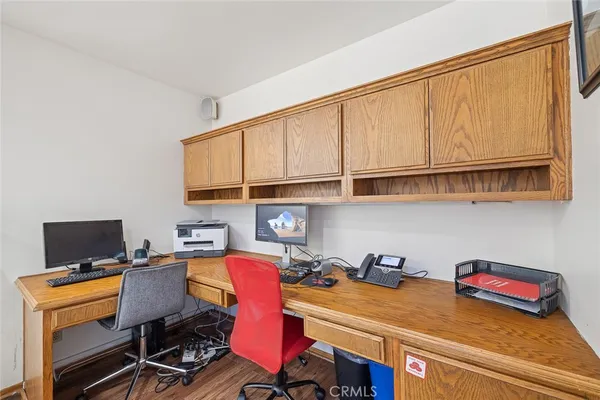 a work room with furniture and wooden floor
