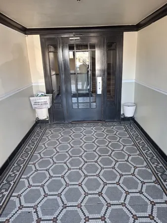 a bathroom with a glass door shower