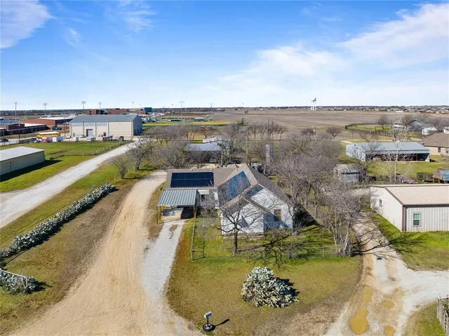 an aerial view of a house with a ocean view