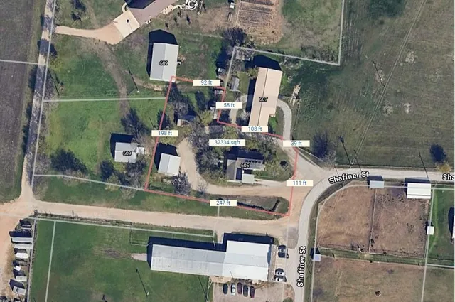 an aerial view of a house with a swimming pool