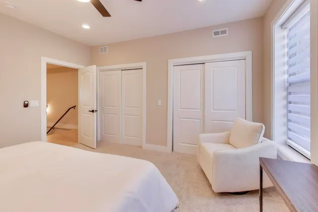 a bedroom with a bed and a couch