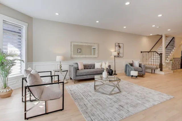 a living room with furniture and a table