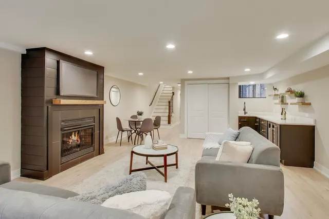 a living room with furniture and a fireplace