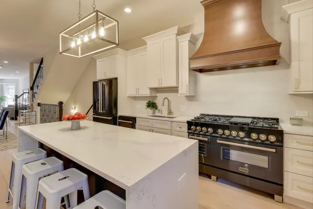 a kitchen with cabinets and appliances