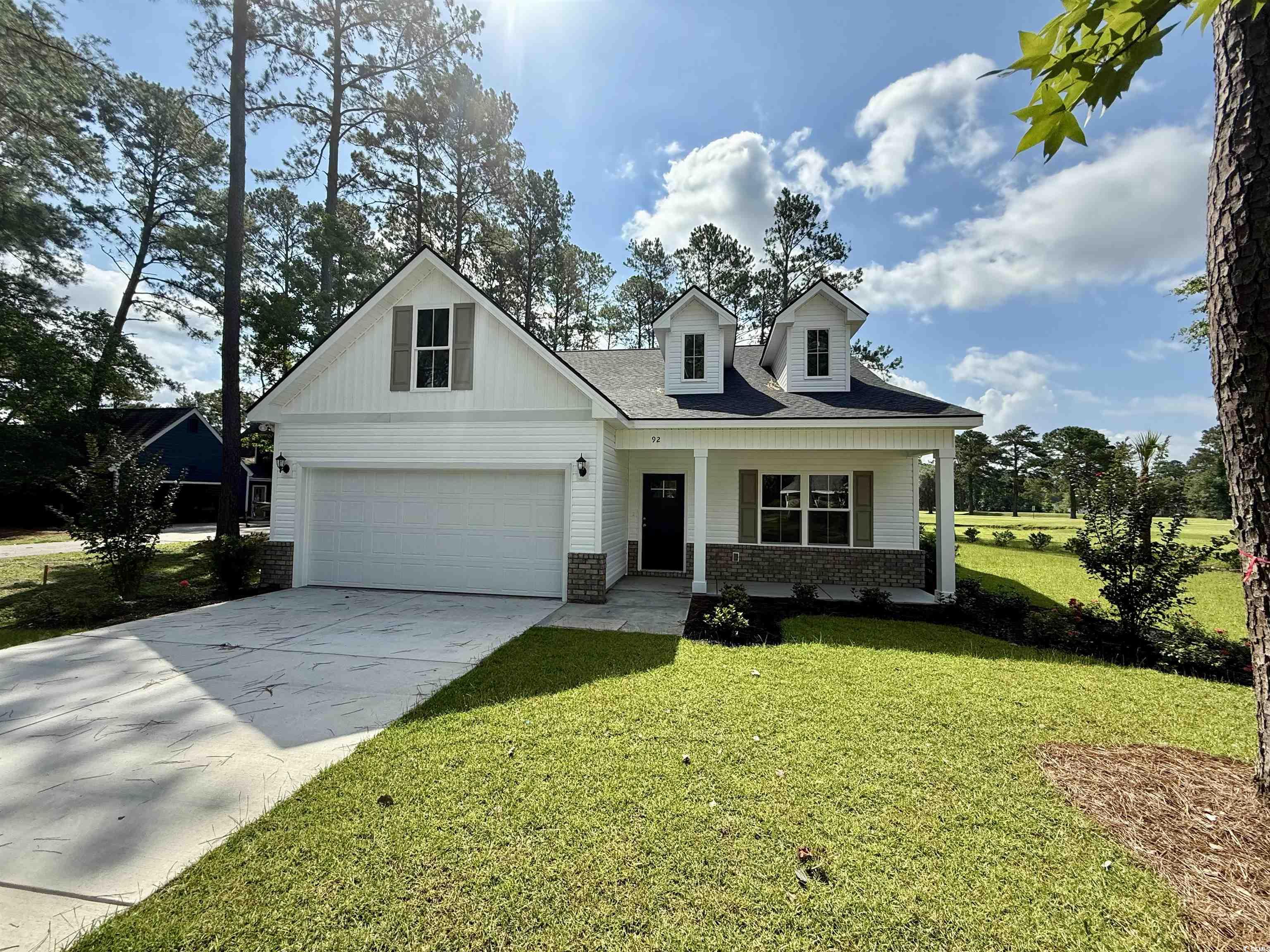 92 Patriot Lane Georgetown, SC 29440 - Photo 1 of 17 View of front of house with brick siding, a porch,