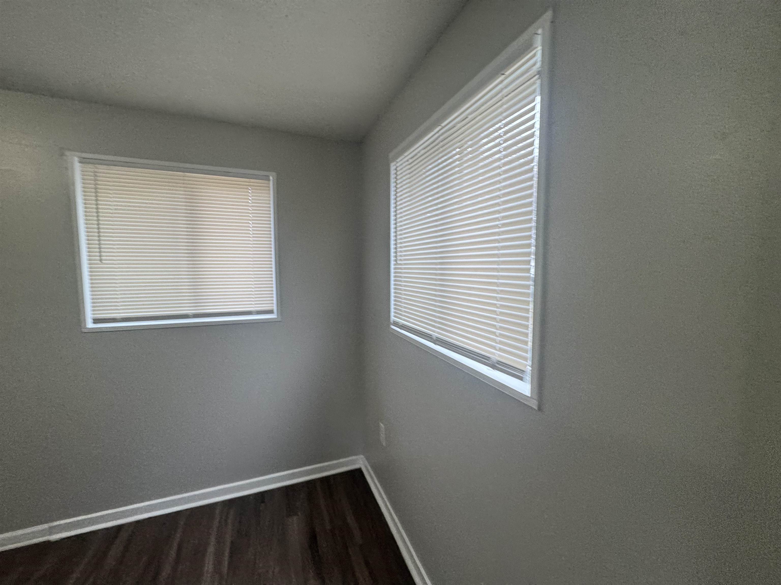220 Elder Road Memphis, TN 38109 - Photo 3 of 9 Unfurnished room with baseboards and dark wood finished floors