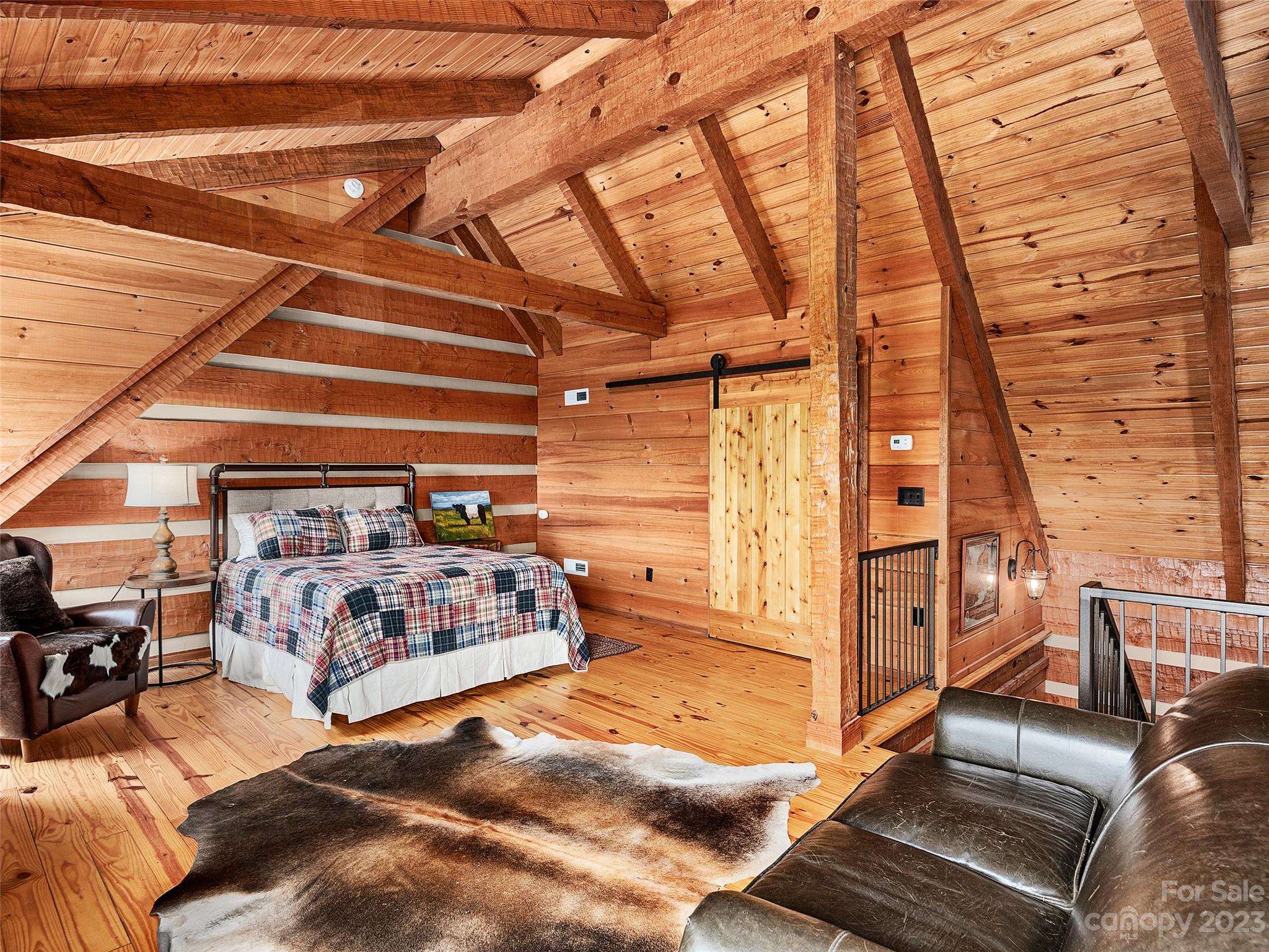 1038 Doggett Gap Road Hot Springs, NC 28743 - Photo 17 of 32 a bedroom with furniture and a window