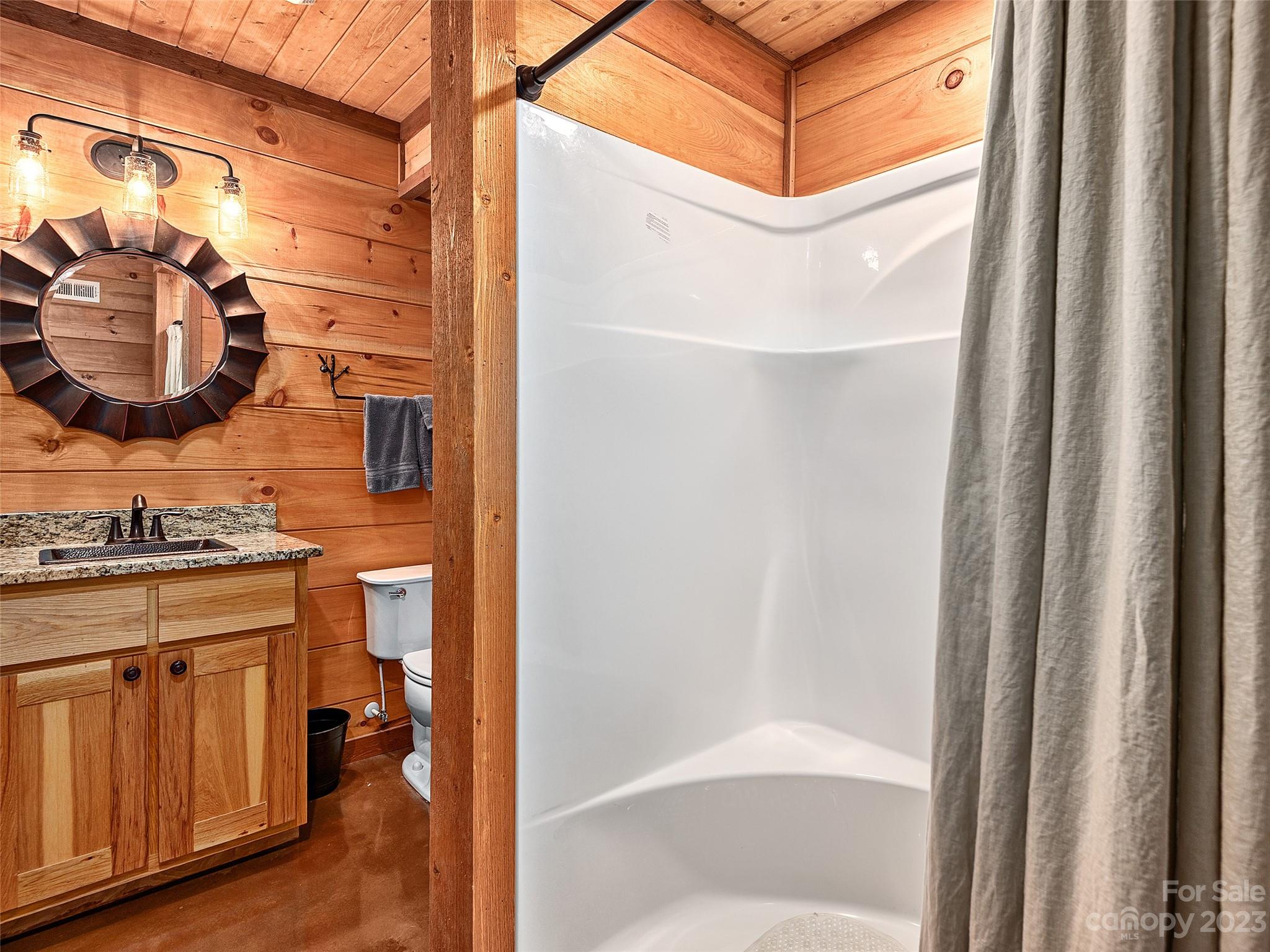 1038 Doggett Gap Road Hot Springs, NC 28743 - Photo 22 of 32 a bathroom with a sink and a mirror