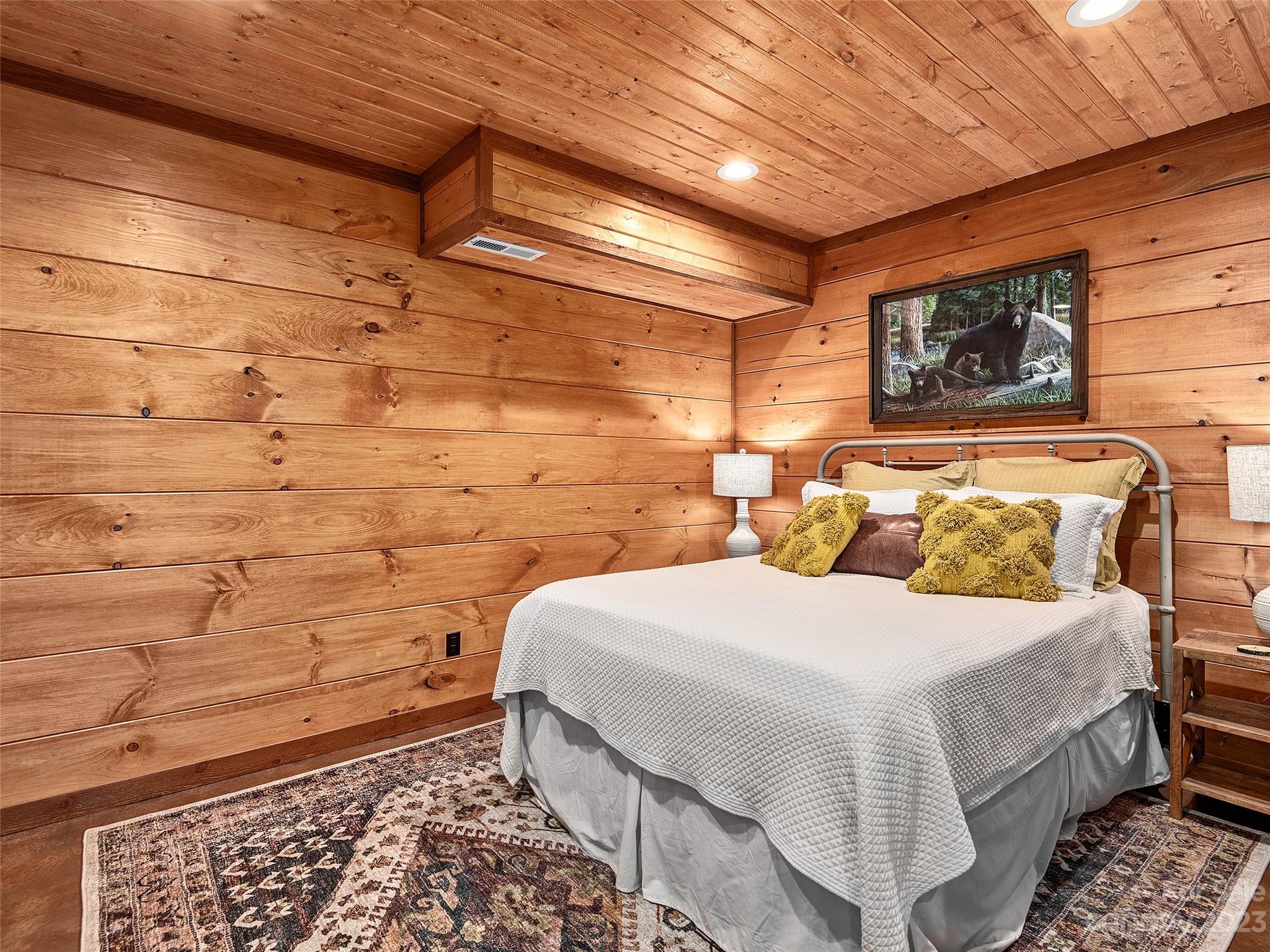 1038 Doggett Gap Road Hot Springs, NC 28743 - Photo 23 of 32 a bedroom with a bed and a window