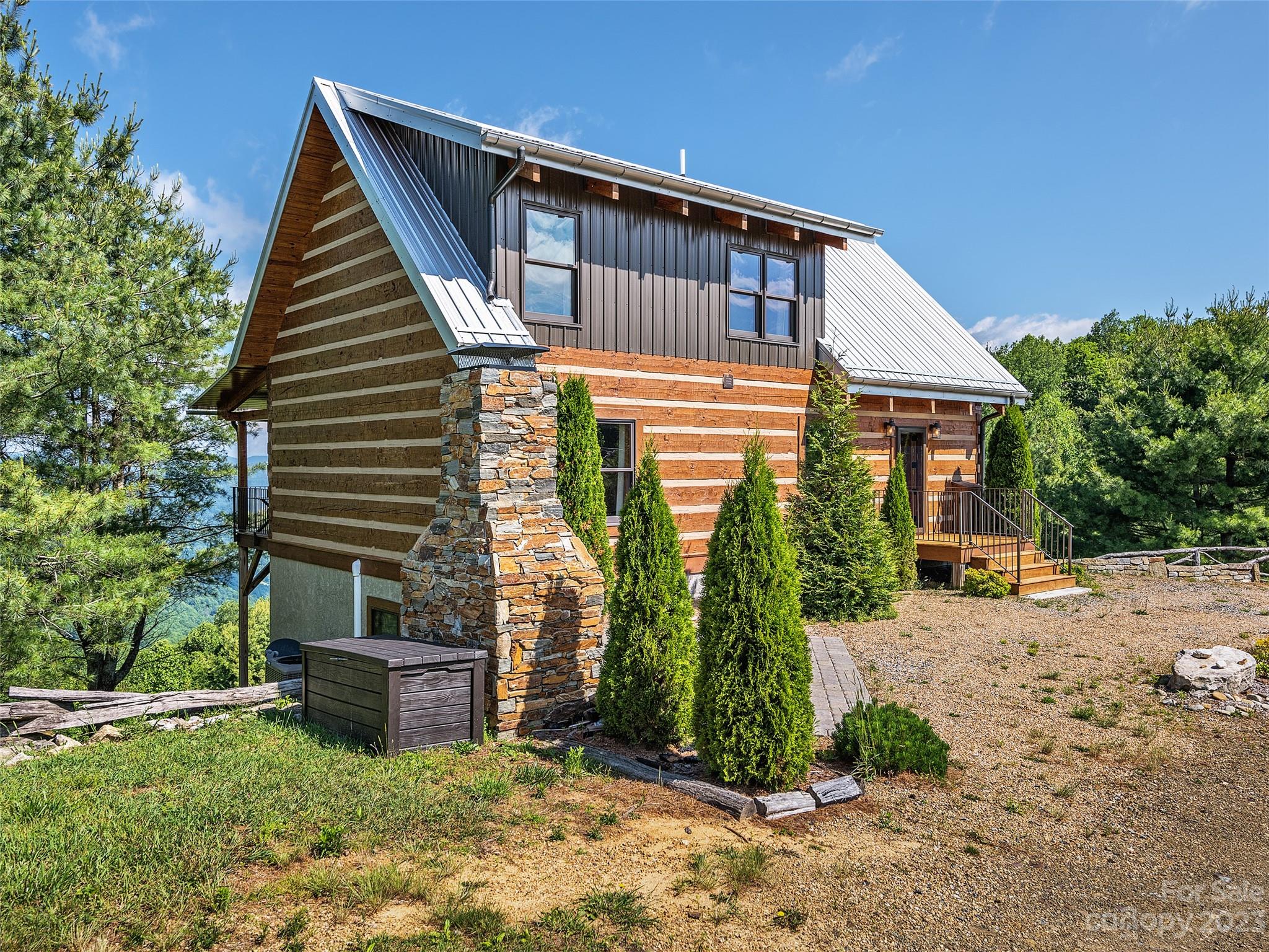 1038 Doggett Gap Road Hot Springs, NC 28743 - Photo 28 of 32 a backyard of a house with seating space