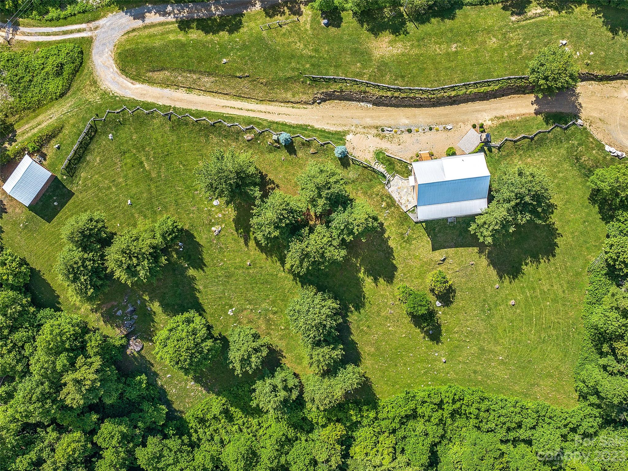 1038 Doggett Gap Road Hot Springs, NC 28743 - Photo 30 of 32 an aerial view of residential house with outdoor space and swimming pool