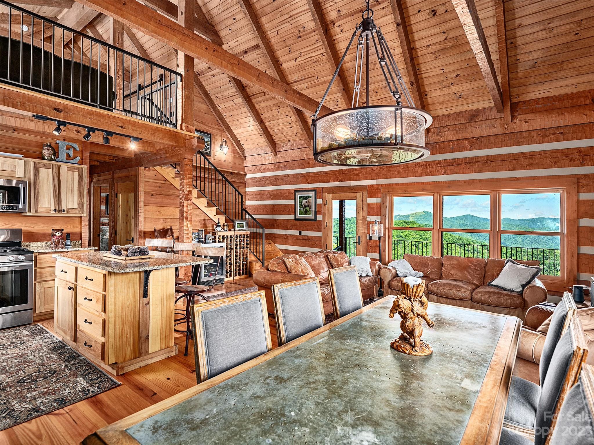 1038 Doggett Gap Road Hot Springs, NC 28743 - Photo 8 of 32 a kitchen with stainless steel appliances granite countertop a sink a stove and a wooden floors