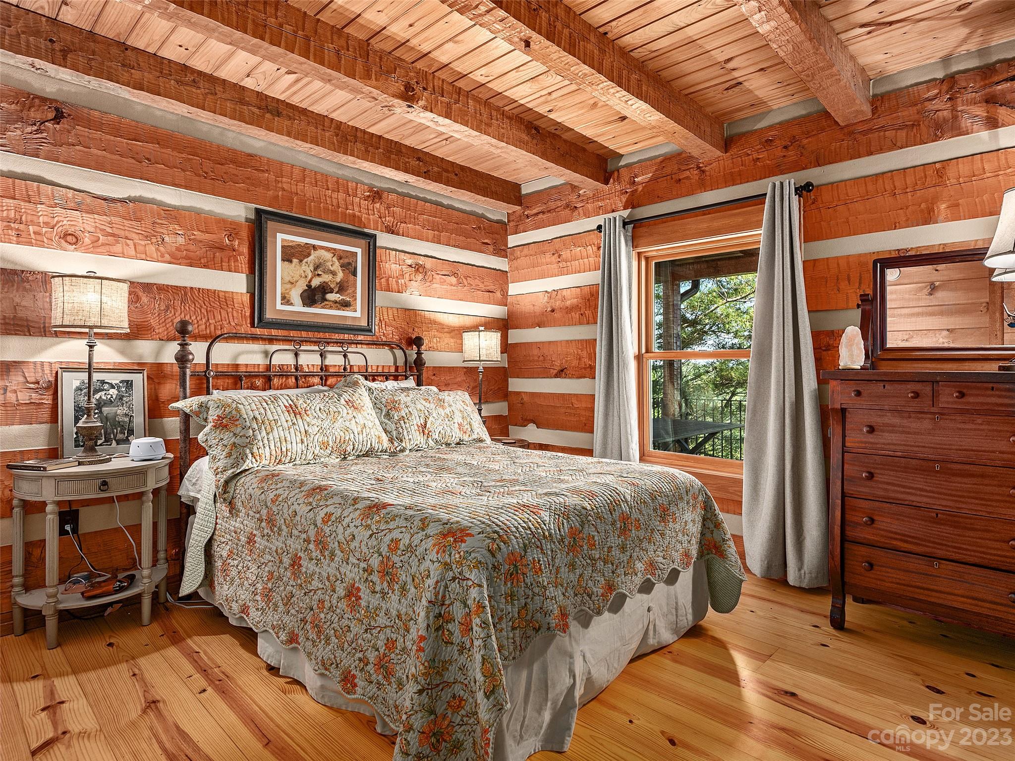 1038 Doggett Gap Road Hot Springs, NC 28743 - Photo 9 of 32 a bed sitting in a bedroom next to a window