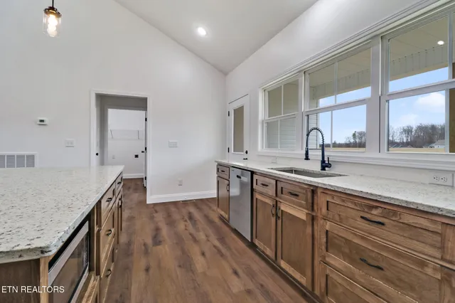 a kitchen with sink and cabinets