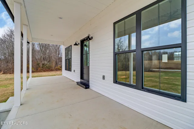 a view of an entryway with a balcony
