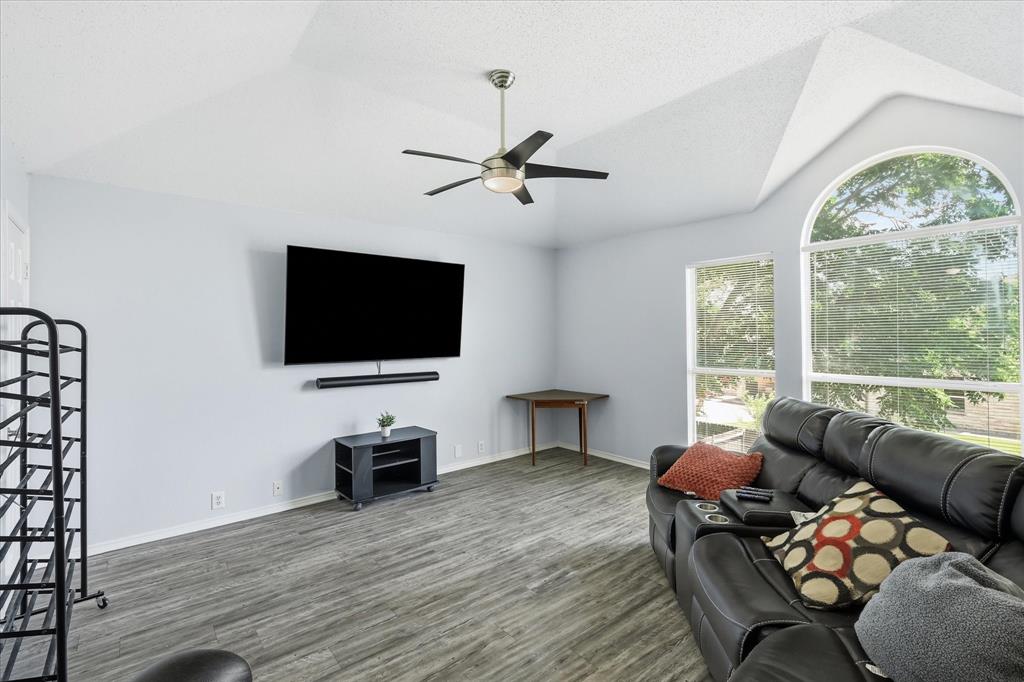 2112 Loon Lake Road Denton, TX 76210 - Photo 25 of 39 Vaulted ceiling with a ceiling fan, wood-finish flooring, and arched window
