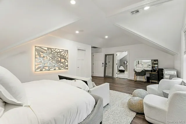 a large white kitchen with a large window