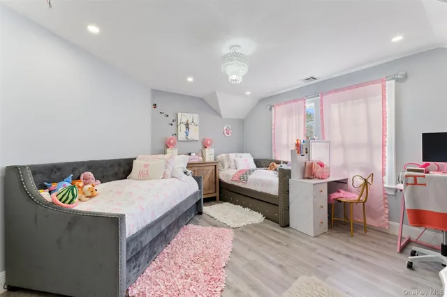 a bathroom with a double vanity sink mirror and shower